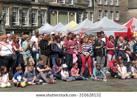 EDINBURGH, SCOTLAND, UK - CIRCA AUGUST 2015: a crowd of people at the Fringe street festival
