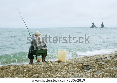 fisherman with fishing rod goes fishing seaborne
