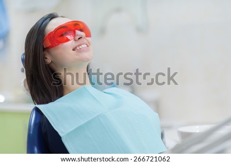 Healthy teeth and dental healthcare. Portrait of female patient at dentist office. She is waiting for her stomatologist doctor. Stomatology.