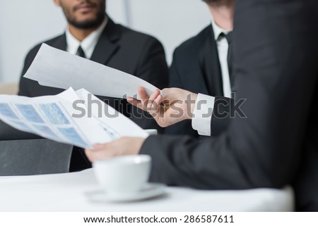 Important business details. Close up of business paper documents. Stocks. Insurance documents. Graphs.