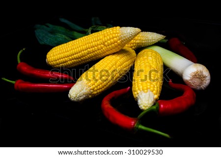 Fresh vegetables on a black background. Vegetarian food and healthy lifestyle. Healthy vegetarian detox concept