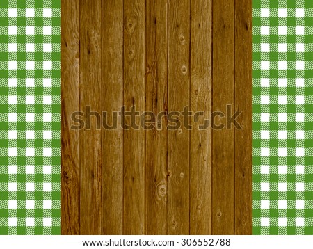 Old wooden planks with traditional vintage green and white tablecloth pattern
