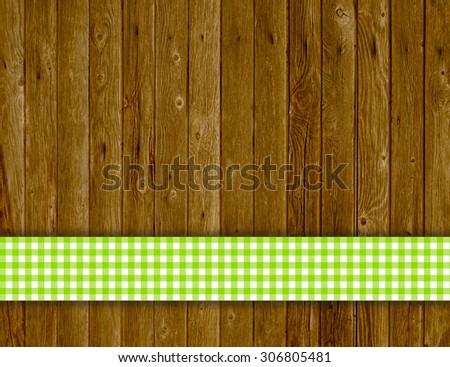 Old wooden planks with green white traditional vintage tablecloth pattern