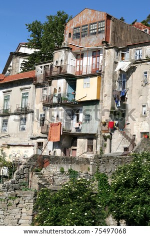 Houses in the historic Ribeira area of Oporto, Portugal. Washing hangs from balconies.