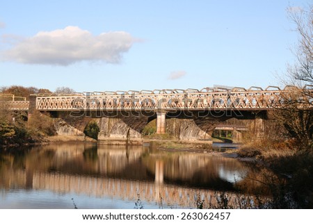 Arched Railway Bridge of England's West Coast Main Railway Line crosses the River Ribble in Preston, Lancashire.
