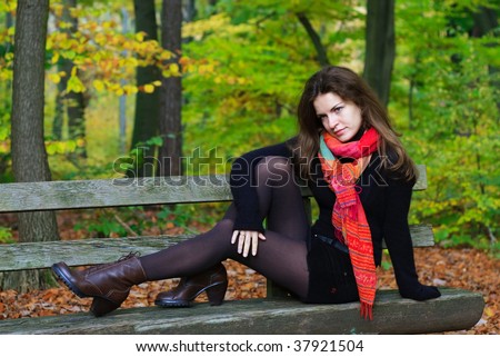 Portrait of young woman in autumn park