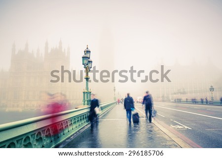 Westminster bridge at foggy morning in London