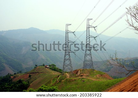 Power lines are led through a mountain in Northwest Vietnam