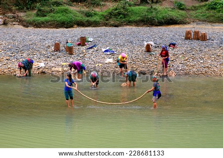 Ha Giang, Vietnam October 23, 2014: A group of ethnic minorities are washing linen bark as raw materials for weaving in the traditional way in Ha Giang, Vietnam