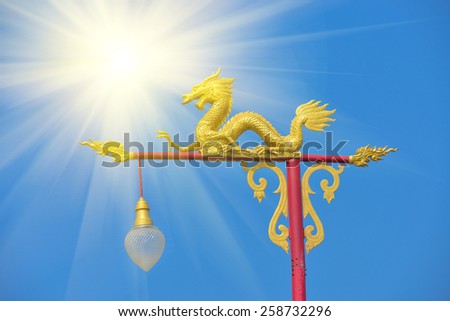 sun beam and Dragon sculpture on the light pole.