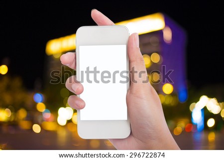 Photo blank. Women hand holding blank mobile smart phone and City night light blur bokeh background.