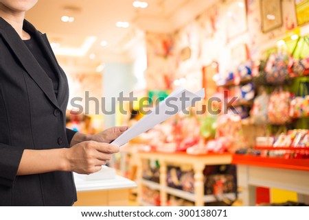 Businesswoman reading a business document.