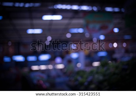 Blurred image of shopping mal and bokeh, blue color cool tone