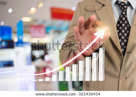 Businessman standing posture hand touch financial symbols coming