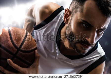 Isolated on black basketball player in action is flying high