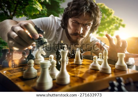 Very serious man is playing the chess