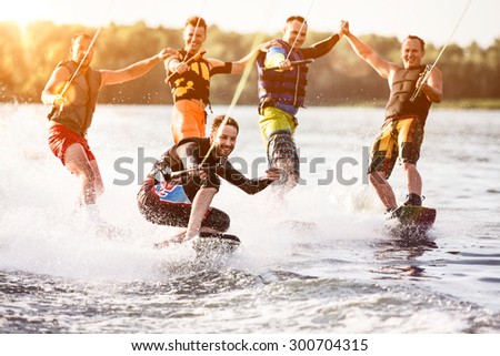 Five wake bord riders are having the fun