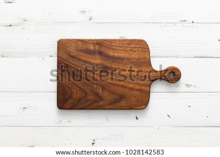 Similar – Image, Stock Photo Empty wooden square cutting board on black table, food display template