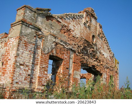 Old ruins of a brick building (farm) in village