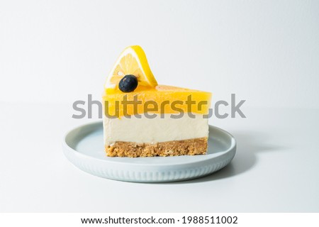 Similar – Image, Stock Photo Sliced lemon pie on blue background. Fruit tart slices