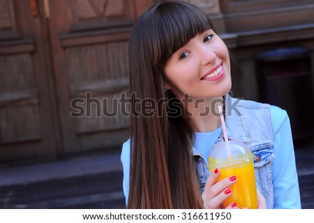 Cute girl with beautiful smile on the street