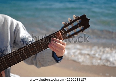 Similar – Image, Stock Photo Man clamping strings on guitar neck