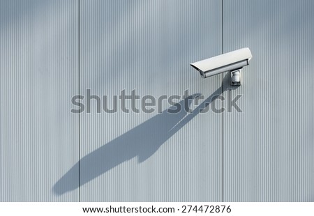 Security camera mounted on a wall.