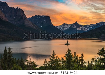 Beautiful colorful sunset over St. Mary Lake and wild goose island in Glacier national park