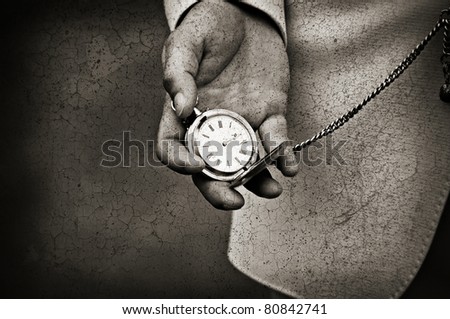 Old watch in the hands. Time concept