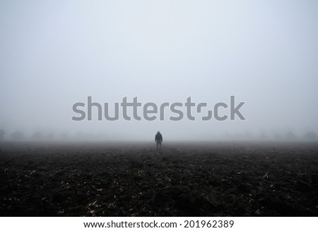 Lone man in the fog