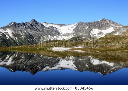 Tremor Mountain and Mount Macbeth reflected in Russet Lake (Garibaldi Park, British Columbia, Canada)