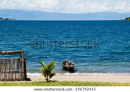 Lonely Boat on Lake Tanganyika / Lonely Boat next to a Shed on the Beach, Lake Tanganyika, Tanzania, Africa