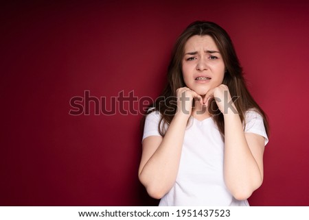 Similar – Image, Stock Photo Sad girl portrait clinging to a gate