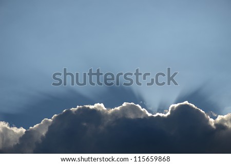 Cloud with a silver lining sun rays shining through that would make a nice boarder or footer to a page