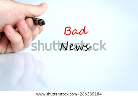 Pen in the hand isolated over white background and text concept Bad News