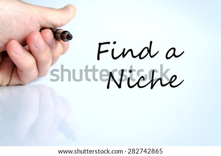 Pen in the hand isolated over white background Find a Niche Concept
