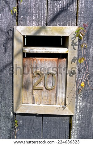 Mailbox Letterbox rusty in wooden door.
