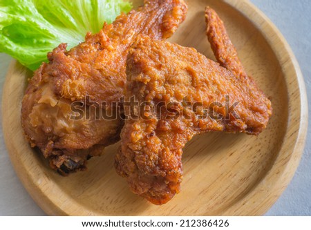 crispy fried chicken on a plate wood