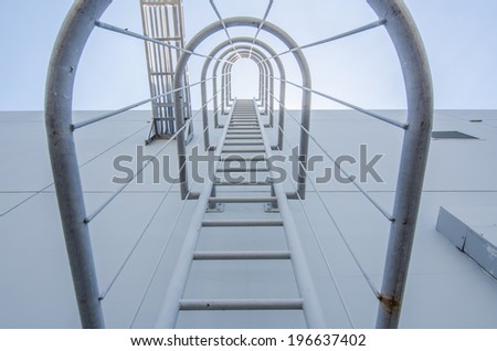 safety ladder up to the top of an industrial