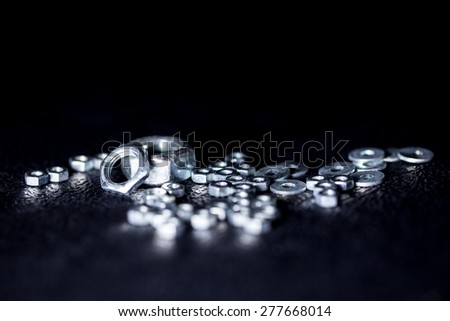 Steel nuts with black background
