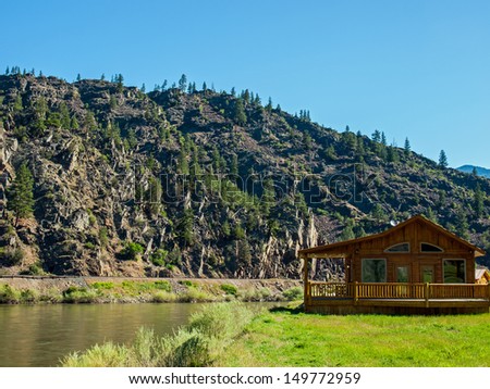 Wide Mountain River and a Log Cabin - Clark Fork River Montana USA