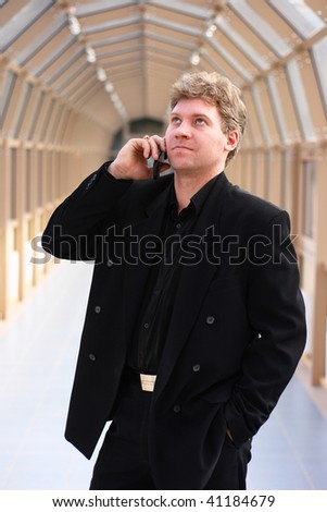 man speaks on telephone