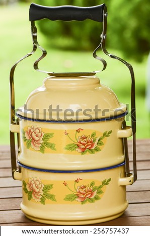Tiffin carrier or food carrier were widely used to transport food over a century ago / Tiffin carrier / Usually made from metal with vitreous enamel coating cured at high temperature
