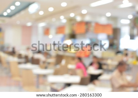 blurred image food court and people