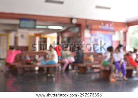 blur passengers wait for train station