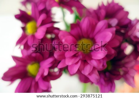 Watercolor style natural background with purple pink flowers on white background. Blur flowers composition.