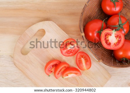 Tomato and sliced tomato prepare on the wood board and for tomato juice