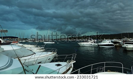 The storm over the harbor with yachts, Stormy sky over sailboats anchored in a marina, Croatia