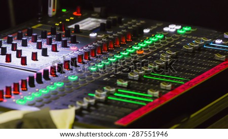 Audio mixer mixing board fader and knobs, Music mixing console with backlit buttons
