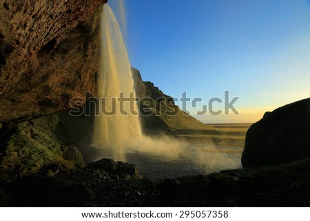 Seljalandsfoss waterfall at dusk, near Eyjafjallajokull glacier in South Iceland.